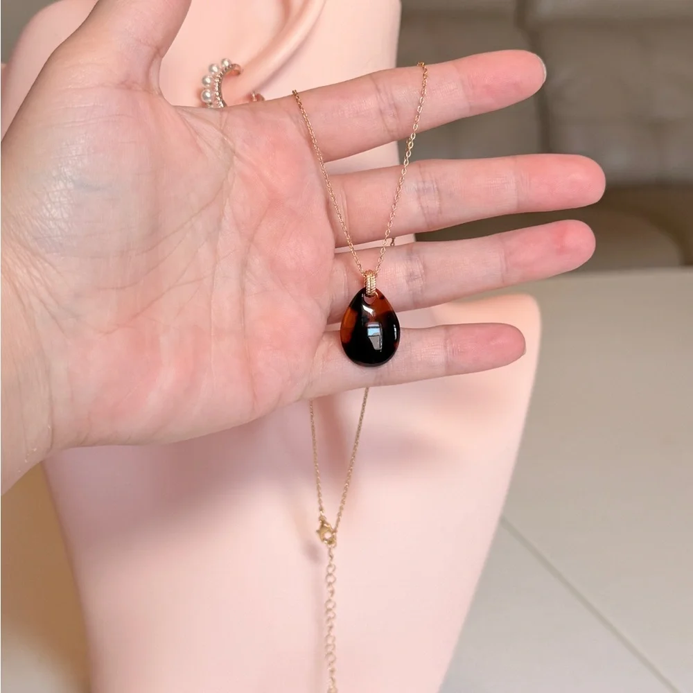 Gold Chain Necklace with Black Teardrop Pendant